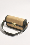 the hattie weave bag by adorne is a crossbody bag converted to a shoulder bag