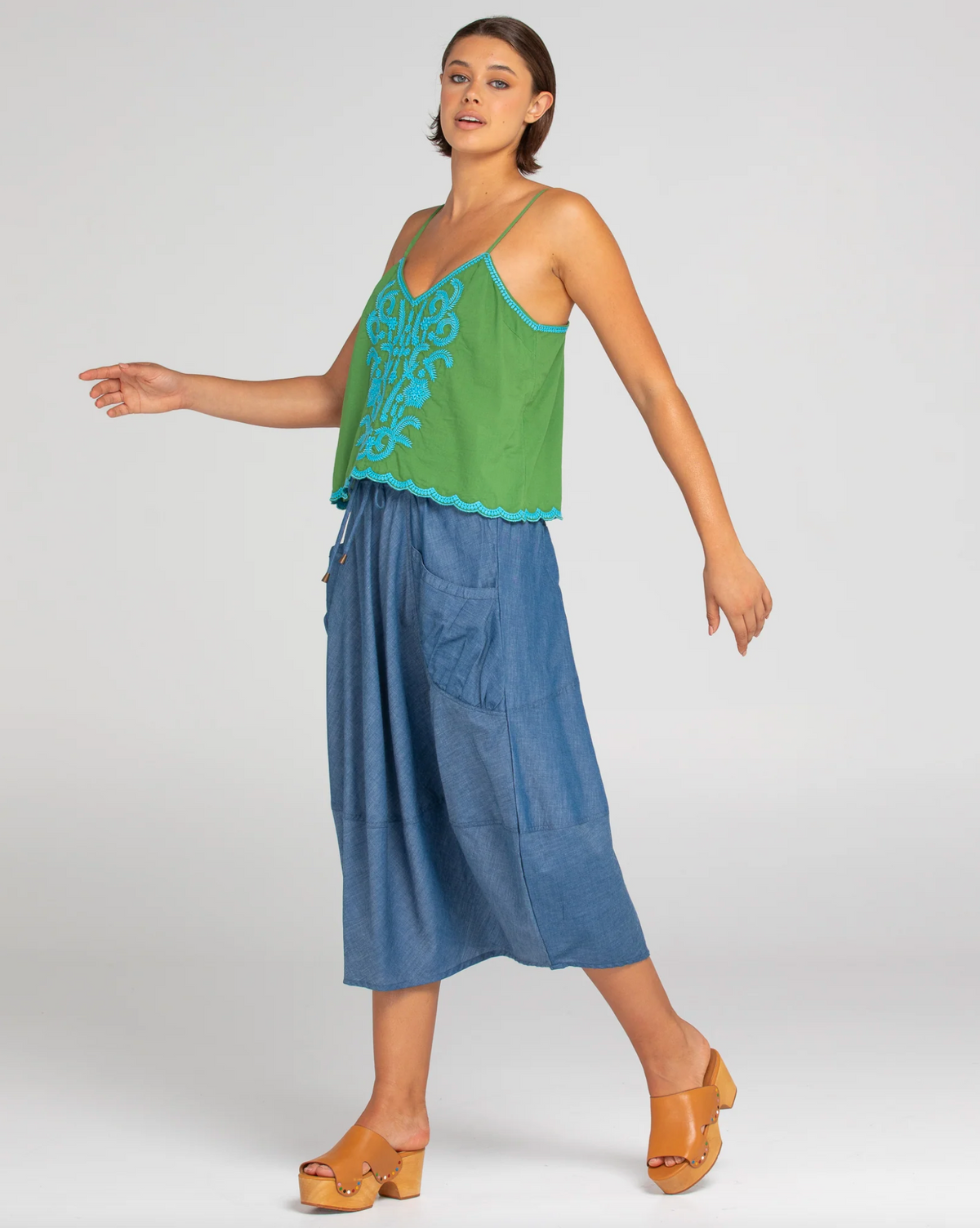 ahana singlet by boom shankar is a grren cotton top with turquoise embroidery