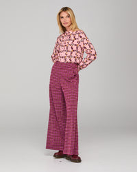 The Akane Shirt by Boom Shankar is a timeless boho piece featuring delicate floral prints and button up the front