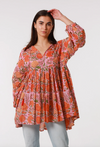 a vibrant orange and pink cotton block print bohemian tunic top