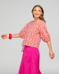 the ava top by boom shankar is a red and white block print  cotton top