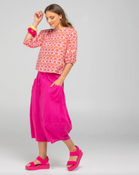 the ava top by boom shankar is a boho cotton block print blouse in red and white naples print