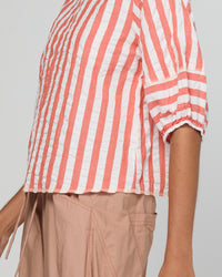 The Ava top by Boom Shankar is a washed watermelon and white stripe cotton seersucker blouse for women