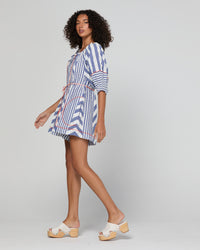 Lucia playsuit by Boom Shankar is a blue and white striped short suit made from cotton seersucker with side pockets and contrast stitiching