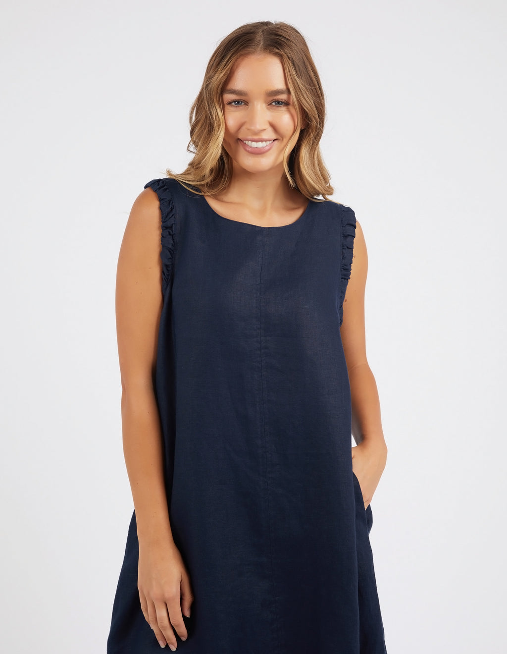 bastia dress by foxwood is a linen sleeveless knee length dress in navy