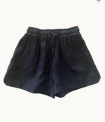 black bronte linen shorts by little lies