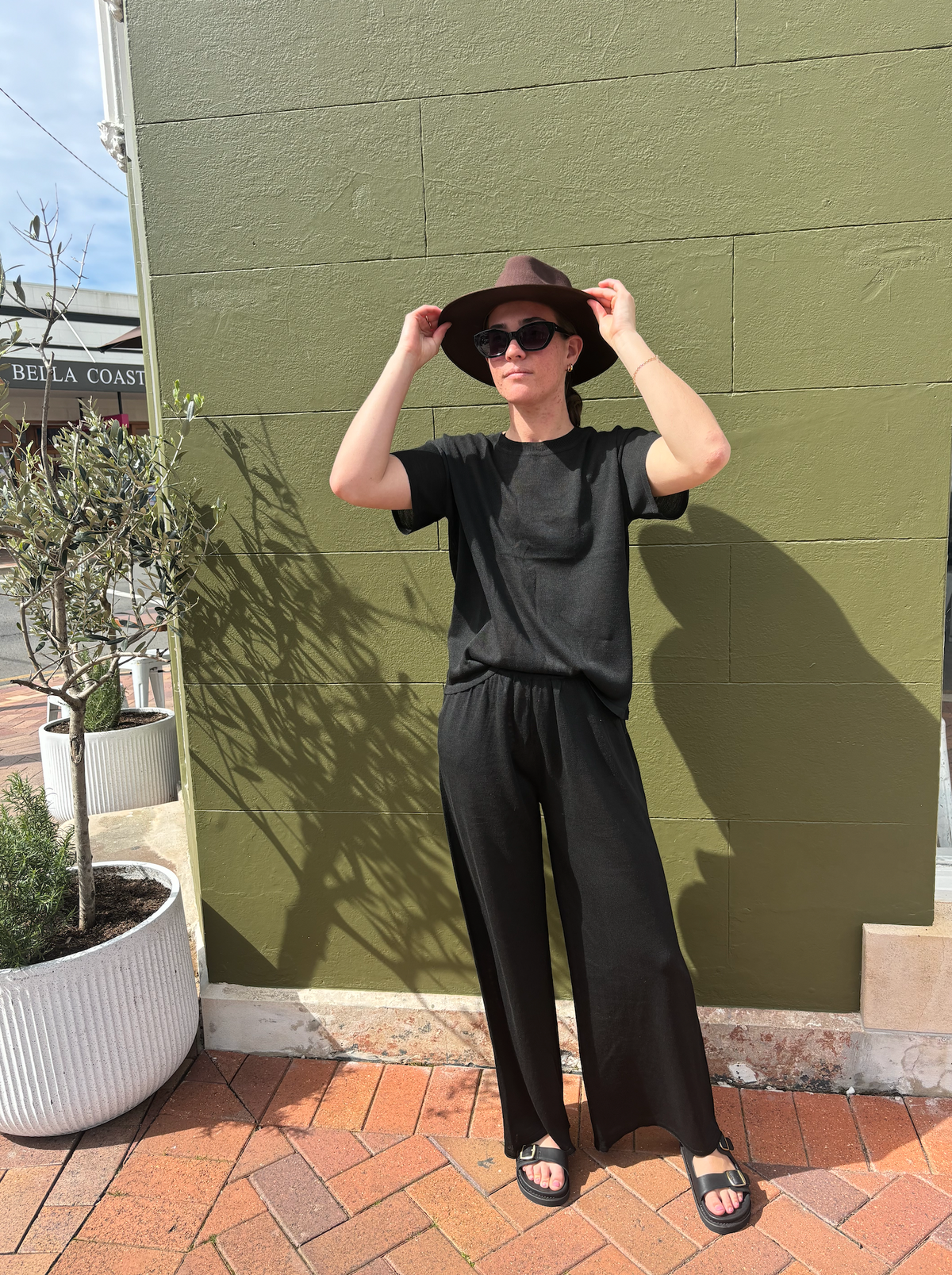 the coast tee by little lies is a black knitted linen summer top