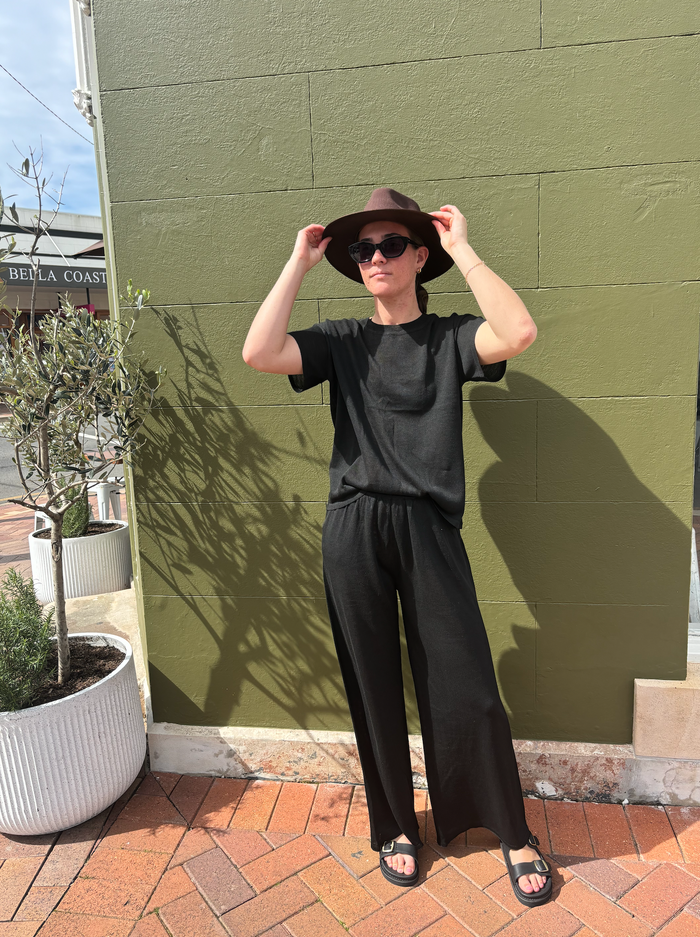 the coast tee by little lies is a black knitted linen summer top