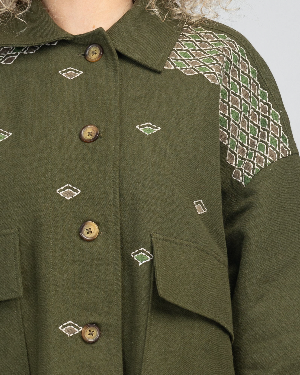 The luxurious Cove Jacket by Boom Shankar is a  bomber style boxy shape with embroidery details has a regimented boho vibe.