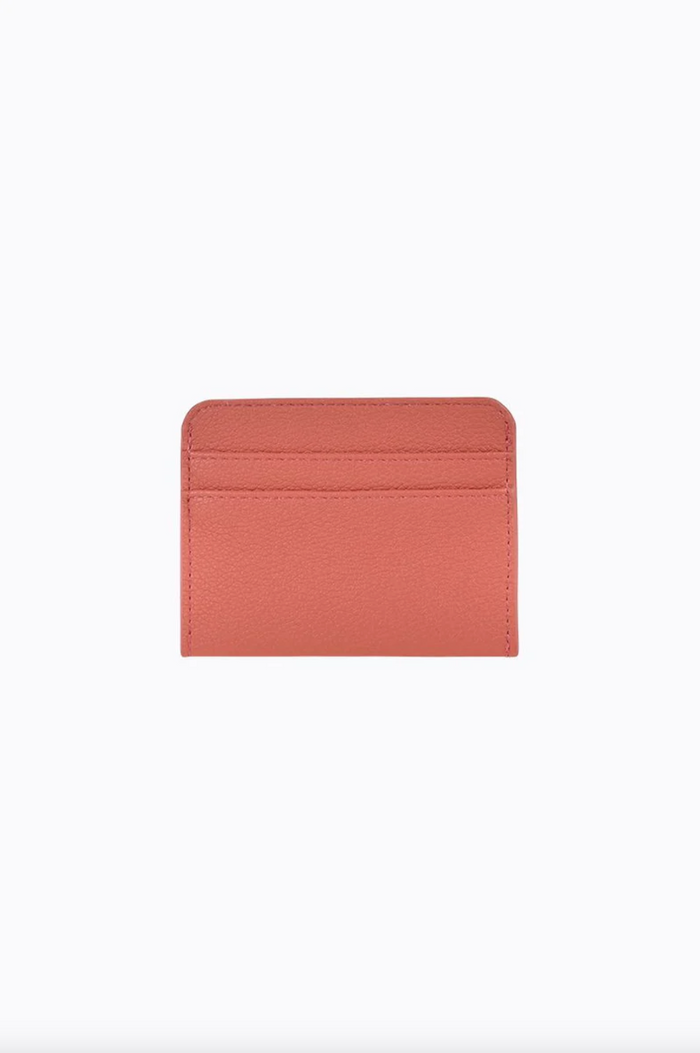 gia card wallet by peta and jain is a faux leather holder for cards in coral
