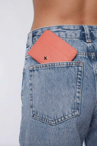 gia card wallet by peta and jain is a faux leather holder for cards in coral