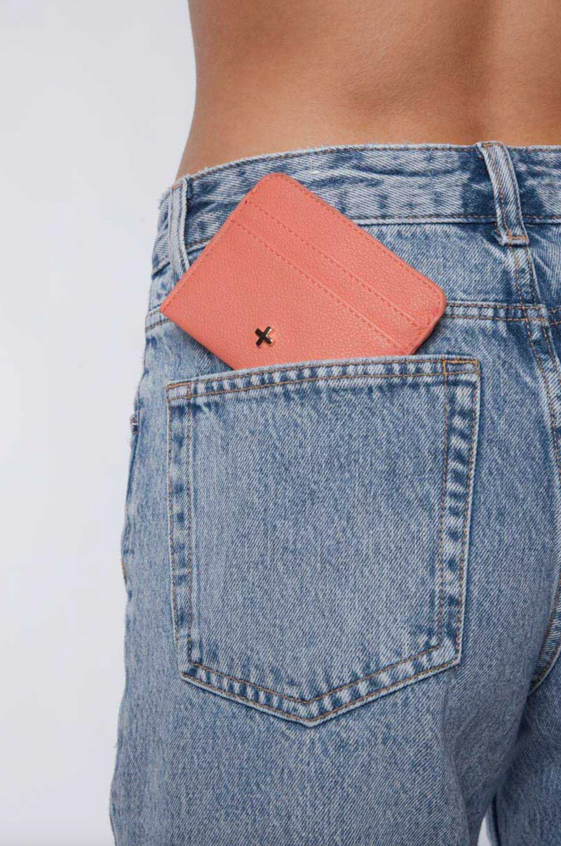 gia card wallet by peta and jain is a faux leather holder for cards in coral