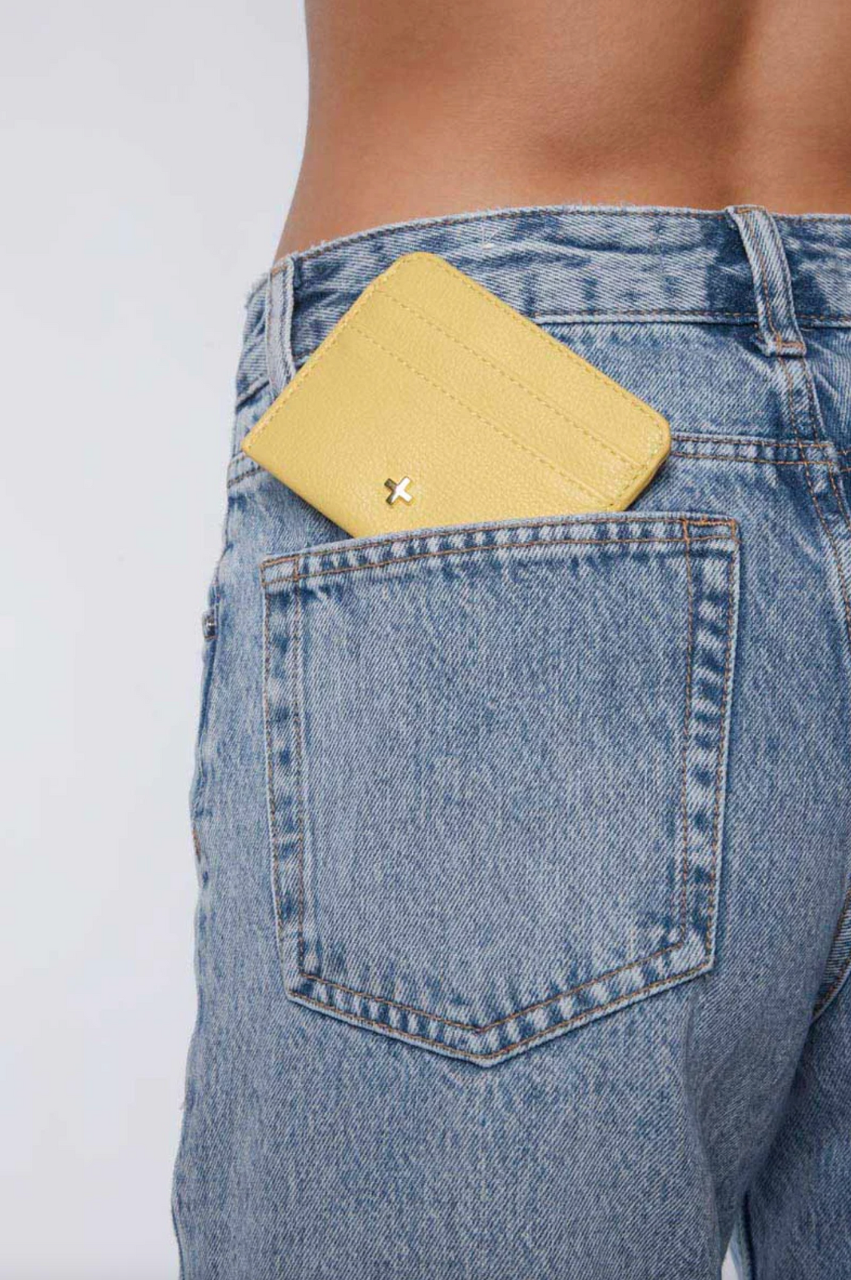 gia card wallet by peta and jain is a faux leather holder for cards in lemon yellow