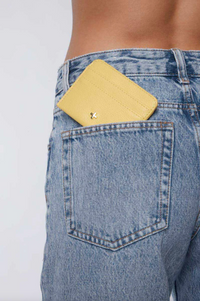 gia card wallet by peta and jain is a faux leather holder for cards in lemon yellow