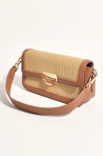 the hattie weave bag by adorne is a crossbody bag converted to a shoulder bag