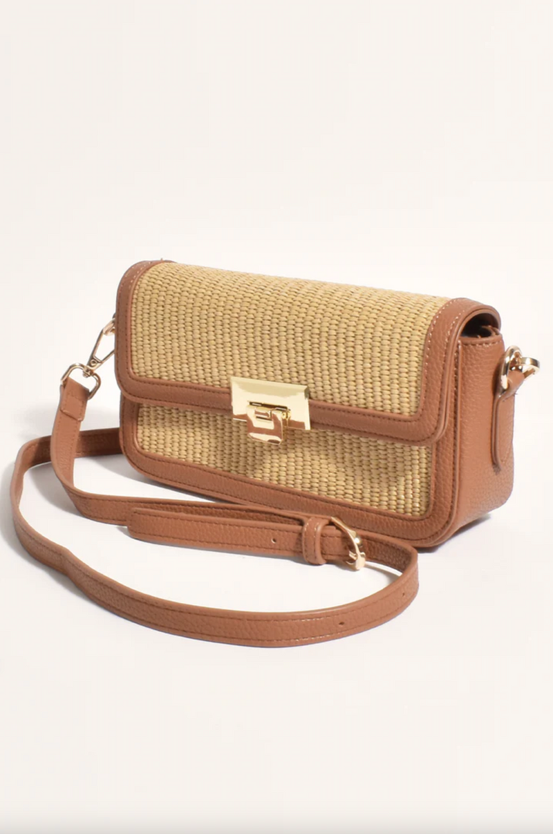 the hattie weave bag by adorne is a crossbody bag converted to a shoulder bag