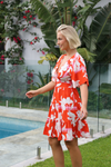 the hibiscus dress from salty bright is a  floral boho party dress