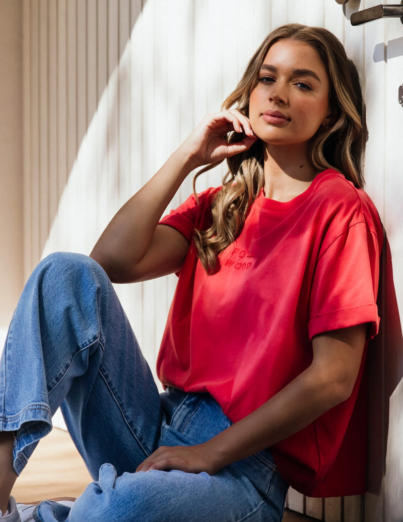 the huntleigh tee by foxwood is a faded red cotton oversized t-shirt with rolled sleeves