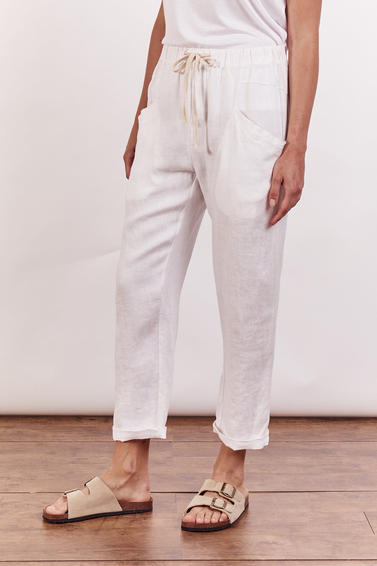 Little Lies linen luxe pants in white with elastic waist and pockets