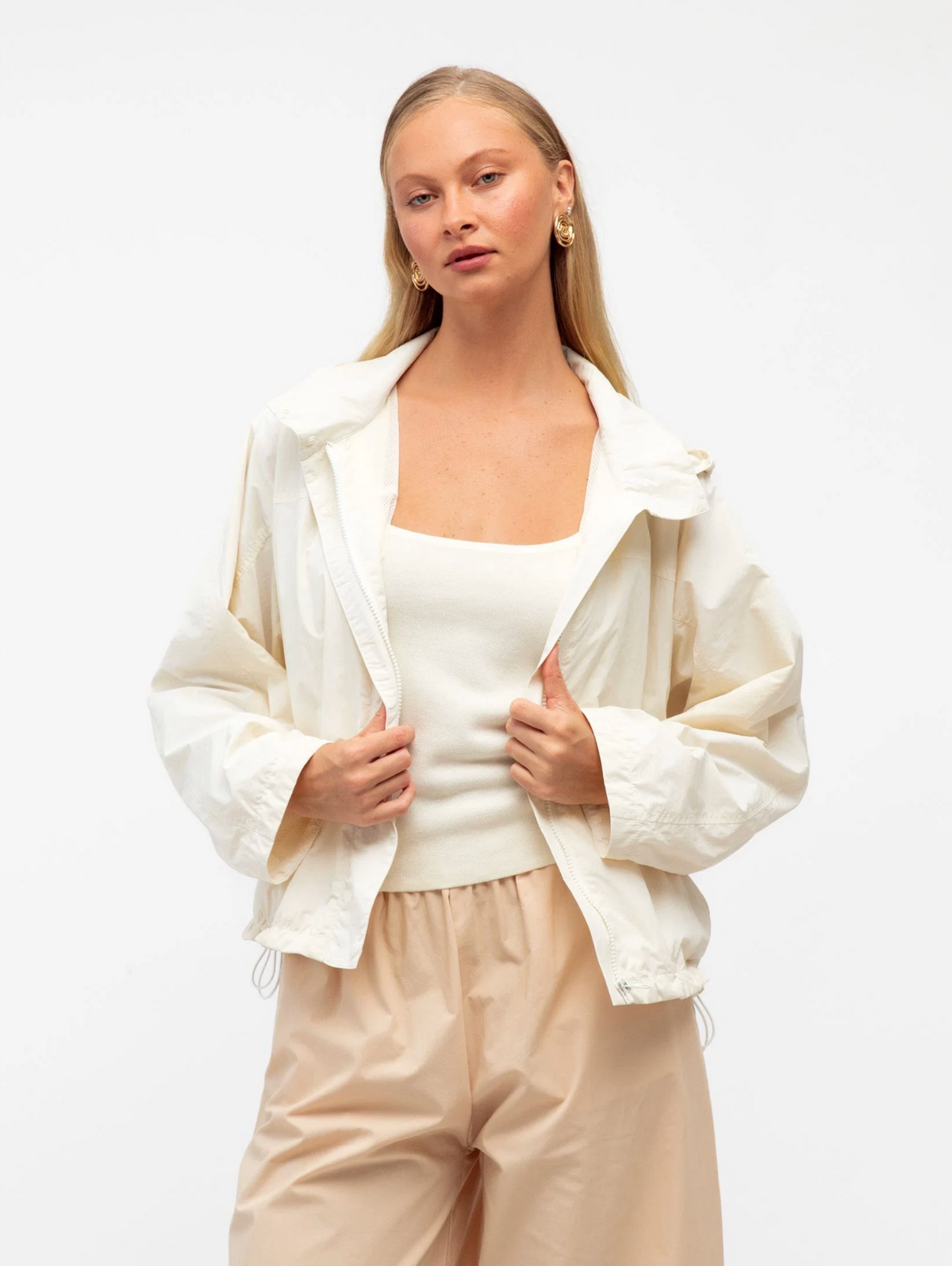 The London Wind Breaker Jacket by Paper Heart is a zip up bone hooded jacket