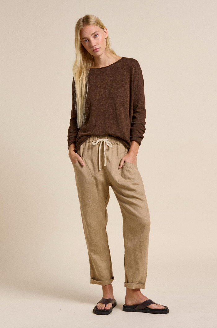 nellie top is a cotton long sleeve lightweight sweater by little lies in chocolate brown