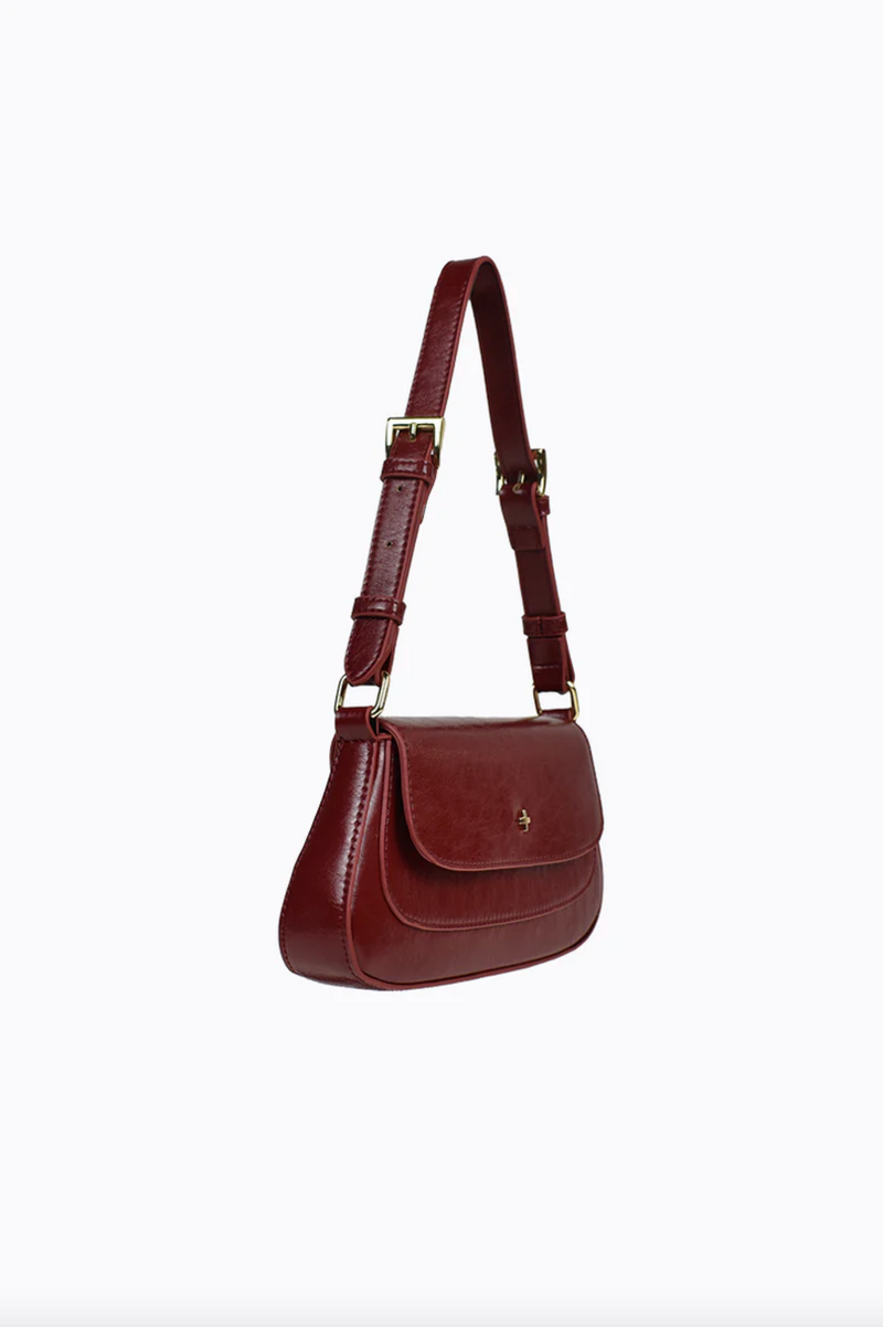 the nikki vegan shoulder bag by peta and jain in cherry red