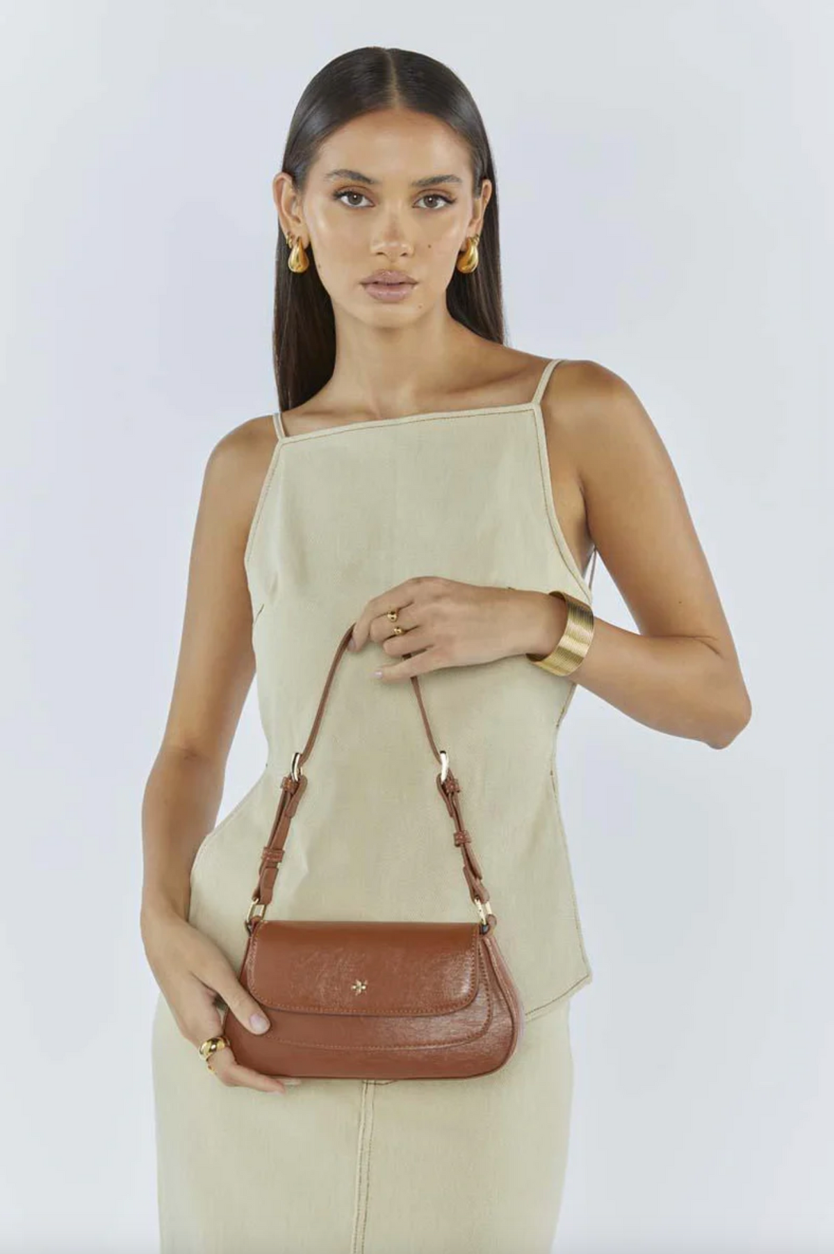 the nikki shoulder bag by peta and jain in tan