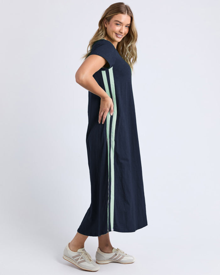 the recovery dress by foxwood is a cotton slub jersey sporty style dress with pockets and side stripe in navy blue
