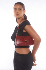 the ripley bag by peta and jain is a vegan cherry red shoulder bag