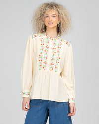 the rosemary top by boom shankar is a feminine linen blend embroidered shirt in cream