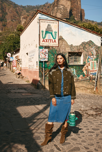 The luxurious Cove Jacket by Boom Shankar. Its bomber style and relaxed and boxy shape with embroidery details has a regimented boho vibe.