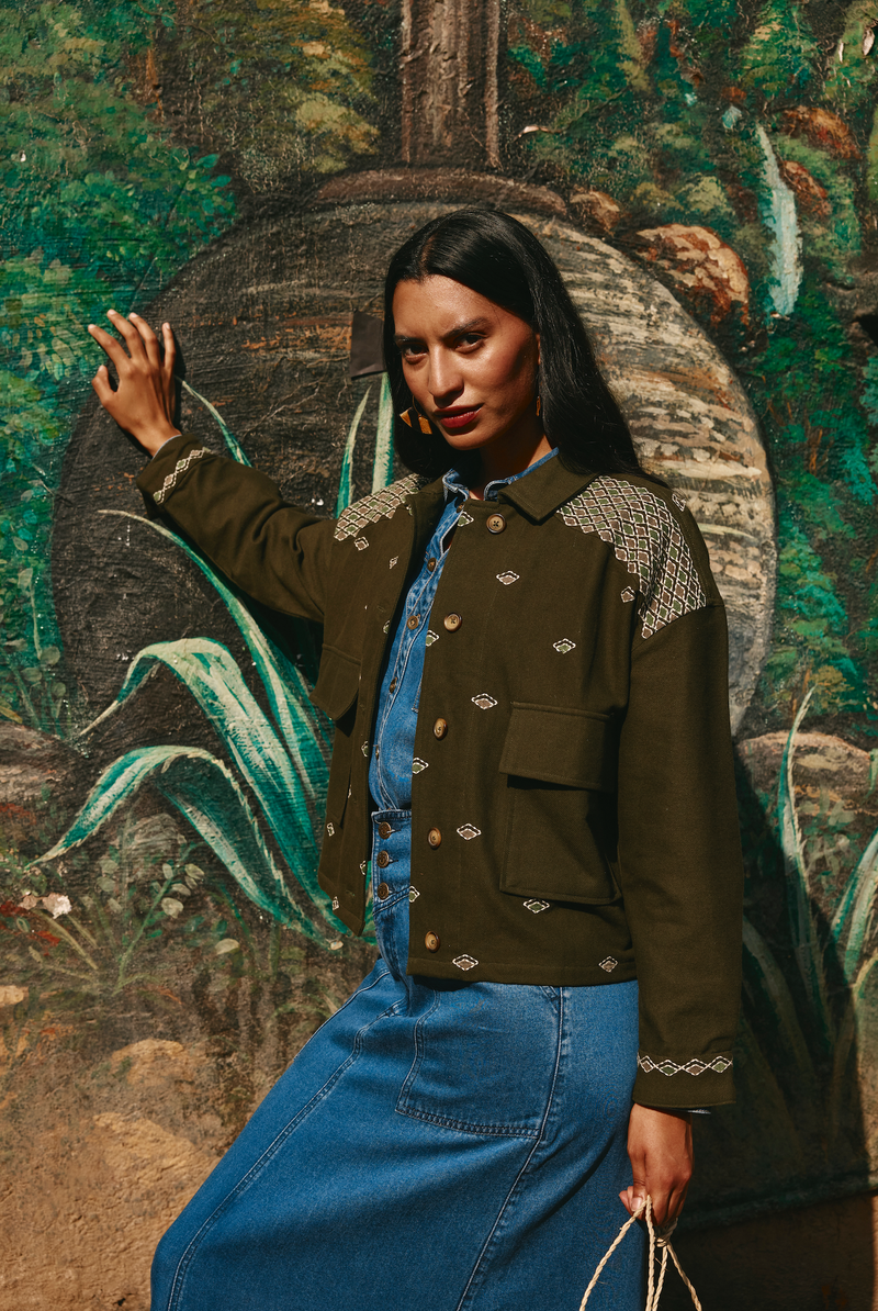 The luxurious Cove Jacket by Boom Shankar is a  bomber style boxy shape with embroidery details has a regimented boho vibe.