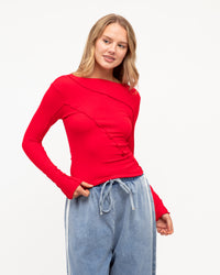 The Sita Long Sleeve Top by Paper Heart is your go-to piece for effortless layering. Crafted from super soft, stretchy fabric in vibrant red.