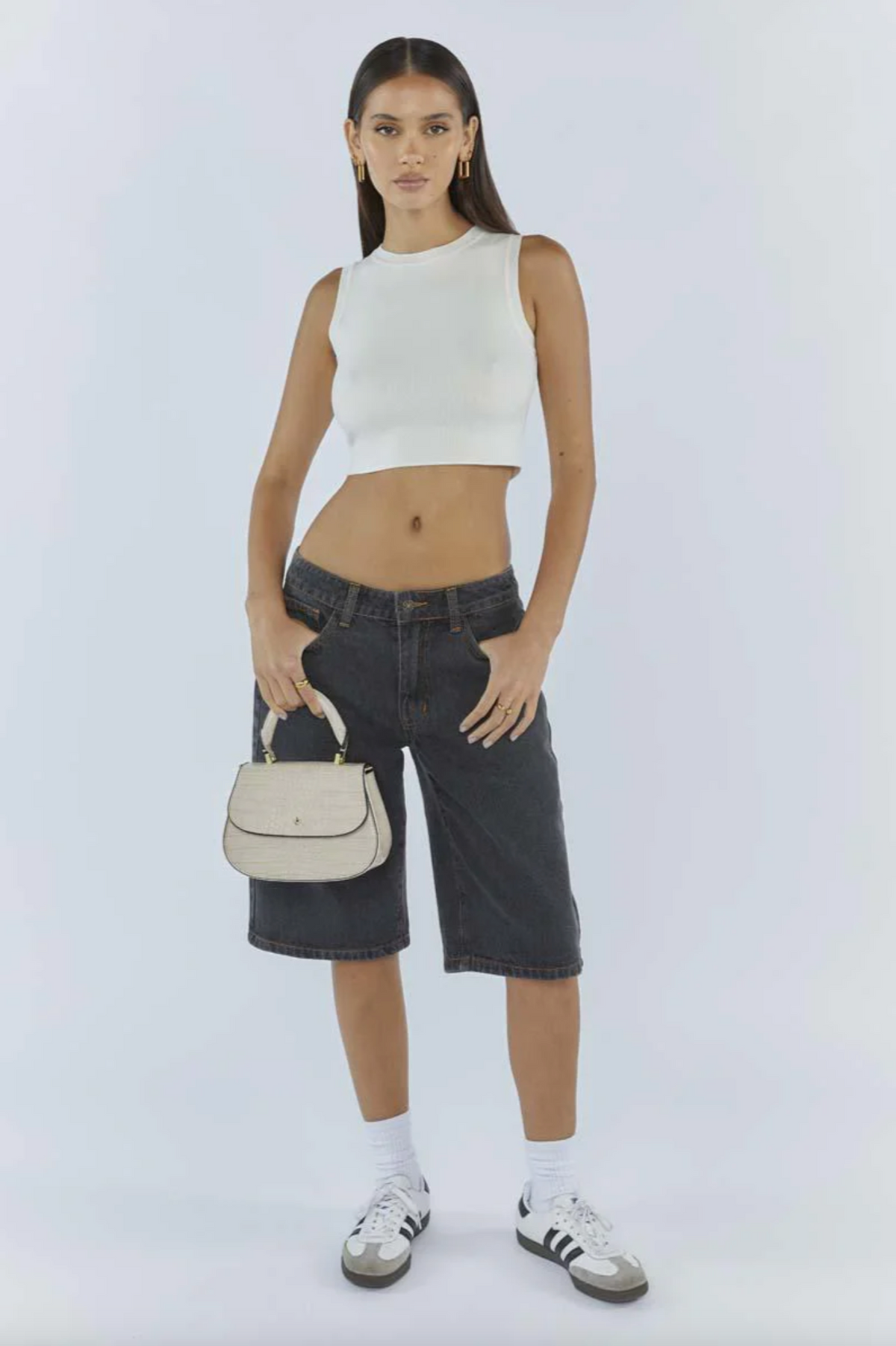 amalie crossbody bag by peta and jain is a vegan leather bag with a top handle in nude croc