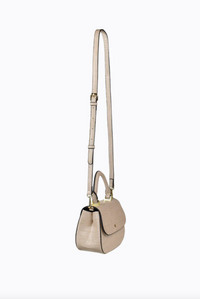 amalie crossbody bag by peta and jain is a vegan leather bag with a top handle in nude croc