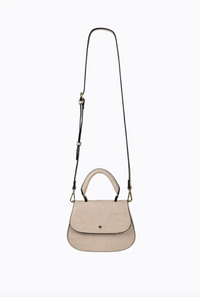 amalie crossbody bag by peta and jain is a vegan leather bag with a top handle in nude croc