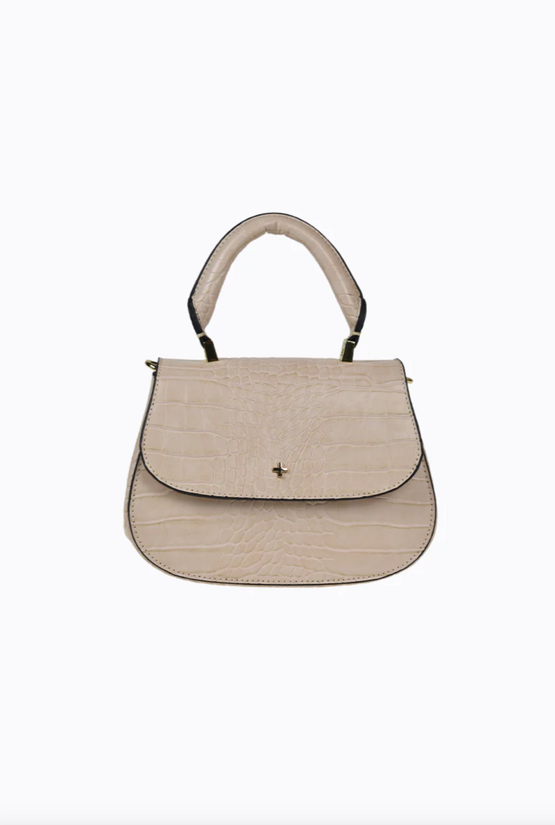 amalie crossbody bag by peta and jain is a vegan leather bag with a top handle in nude croc