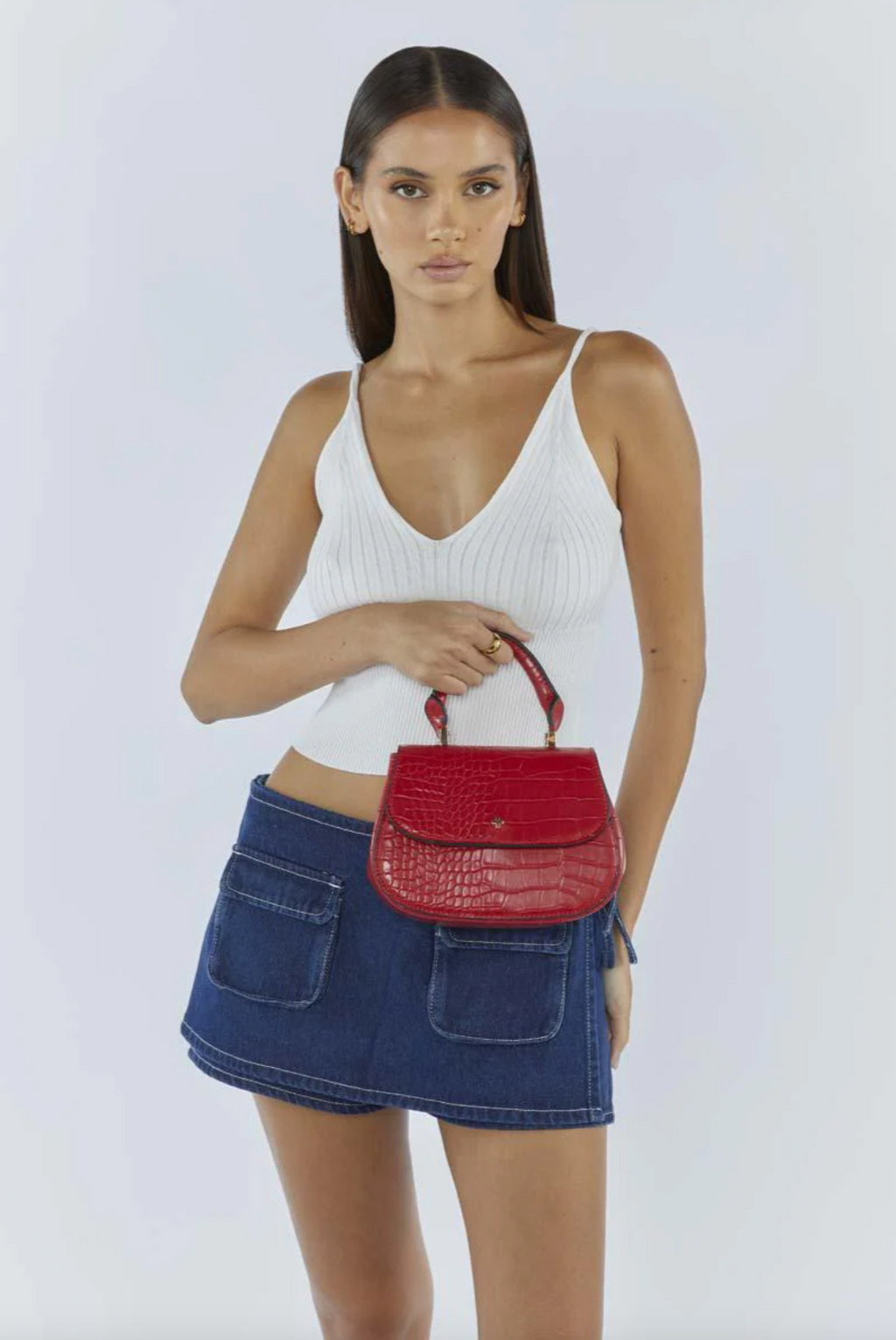 amalie crossbody bag by peta and jain is a vegan croc leather bag with a top handle in red 