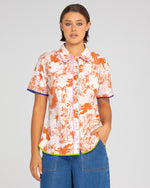 The cuba shirt from boom shankar is a button up short sleeve shirt with rust palm print