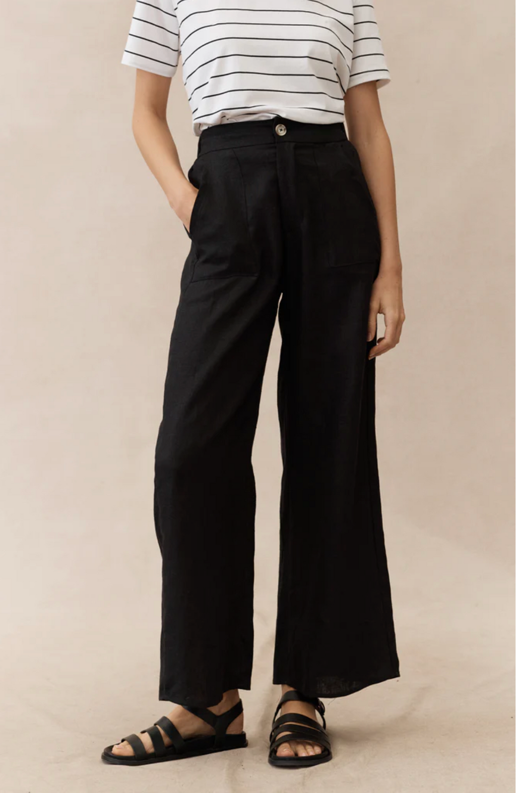 The Jude Linen pants by Little Lies are a wide leg black linen pants with zip and button closure and side pockets 