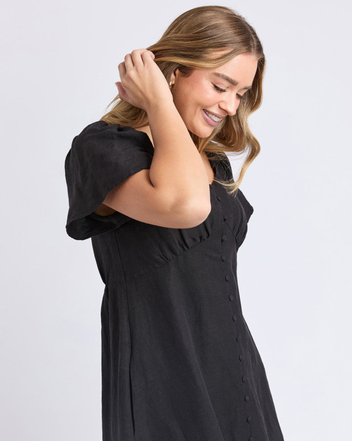 a black linen dress by foxwood with pockets and sweetheart neckline