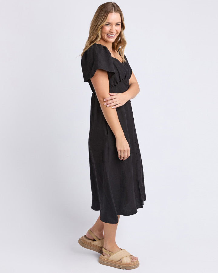 a black linen dress with pockets and sweetheart neckline by foxwood