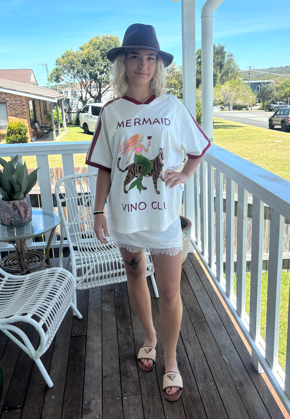 Mermaid vino club tee by frankie is a white cotton t-shirt with a mermaid riding a tiger sipping wine