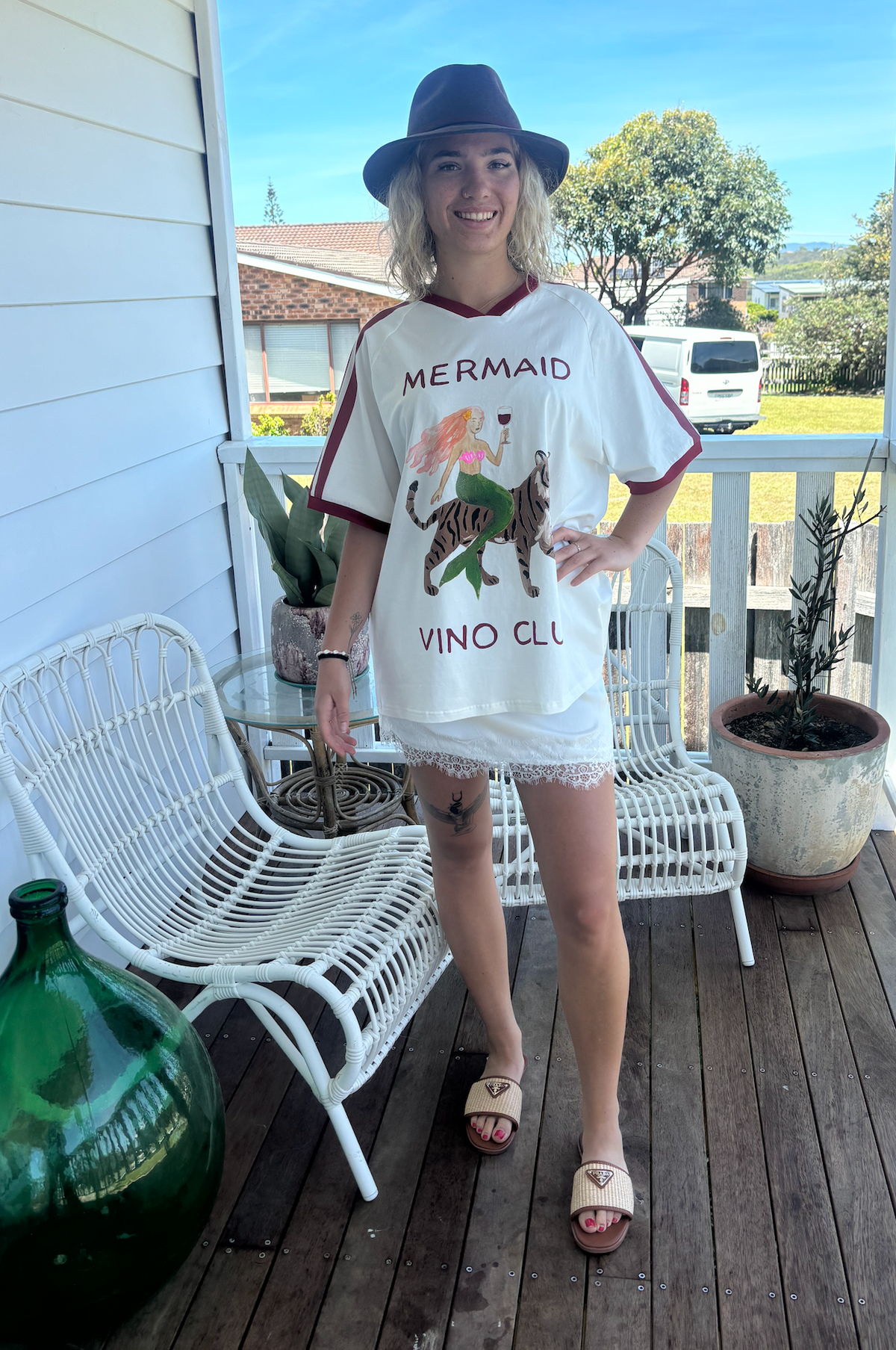 Mermaid vino club tee by frankie is a white cotton t-shirt with a mermaid riding a tiger sipping wine