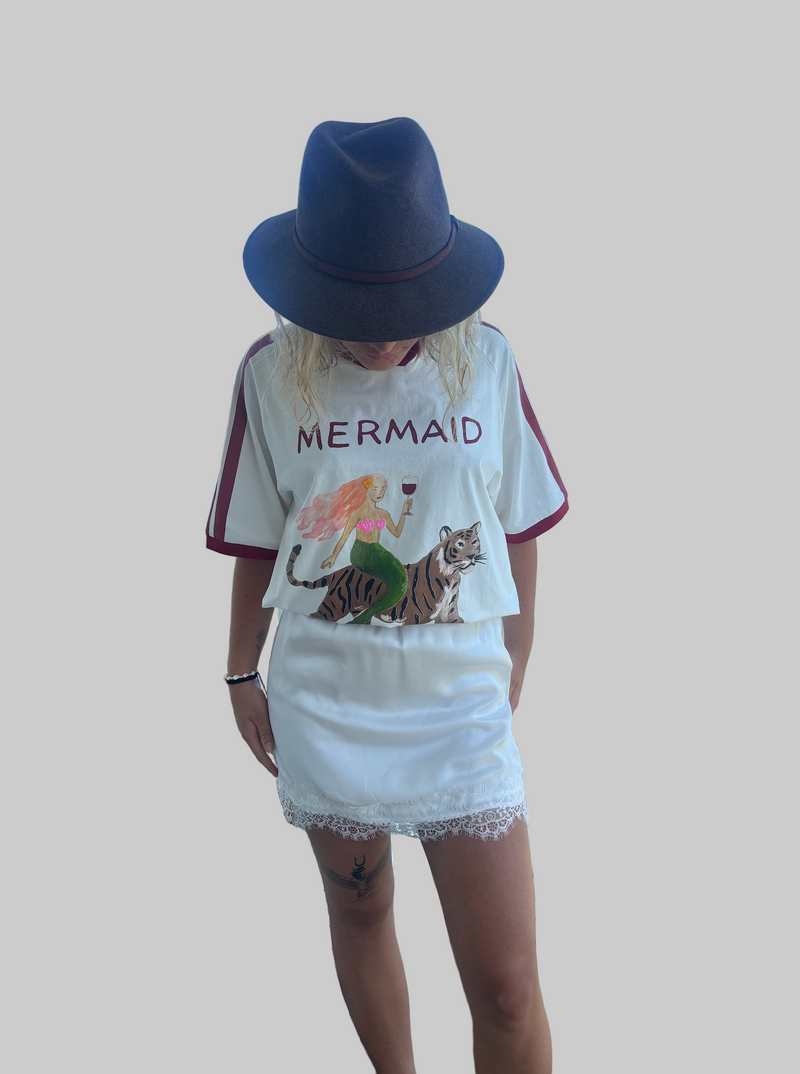 Mermaid vino club tee by frankie is a white cotton t-shirt with a mermaid riding a tiger sipping wine