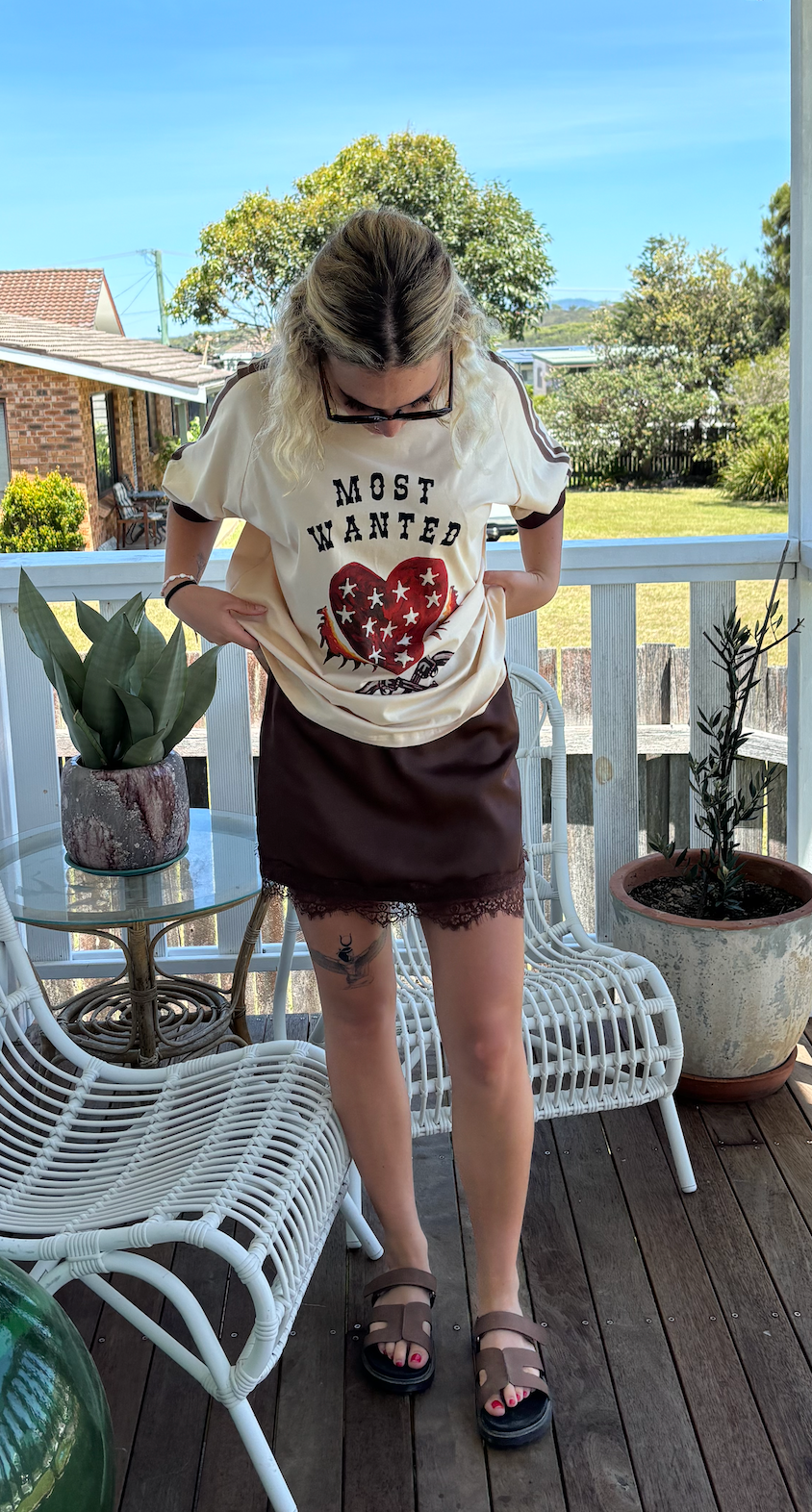 most wanted tee by frankie is a cotton t-shirt with a flaming heart and gun image with billie lace slip skirt