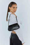 nikki shoulder bag by peta and jain in black is a vegan fashion accessory online