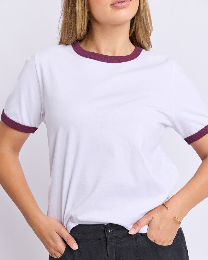 The Polaroid Ringer Tee by Foxwood is a cotton white t-shirt with plum contrast neck band and a hint of retro charm