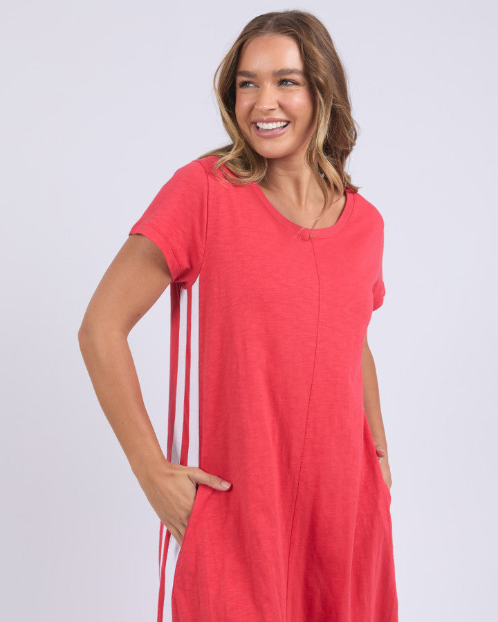 the recovery dress by foxwood is a red cotton v-neck a-line dress with pockets