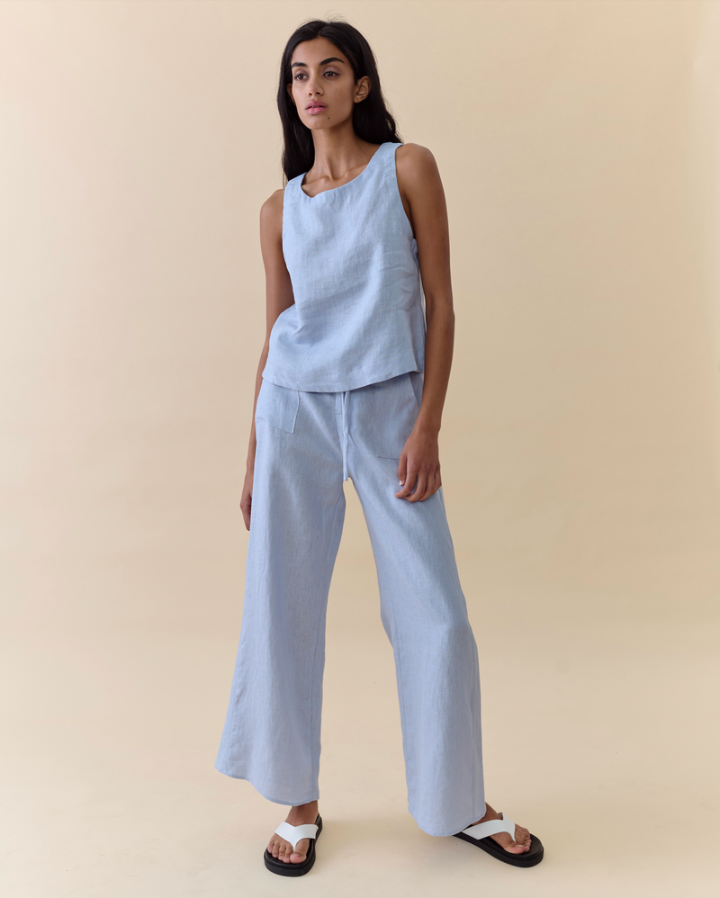 remy pants in pale blue linen with pockets by little lies with a soft knitted pale blue spring tank top